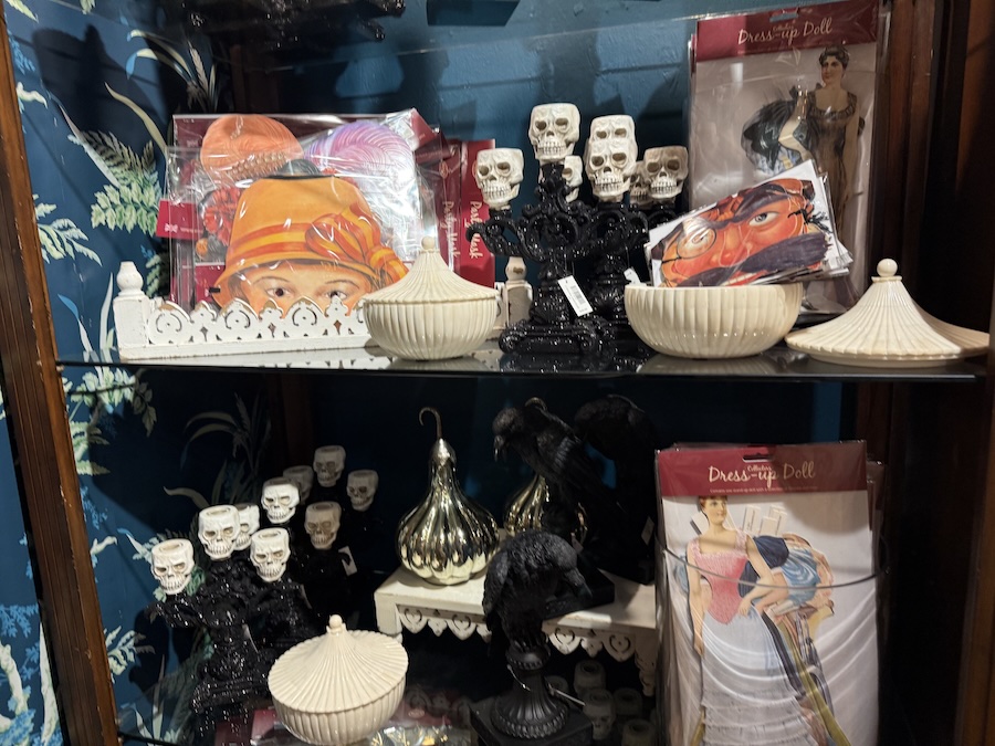 Decorative Halloween candlesticks displayed among seasonal decor at Roger’s Gardens