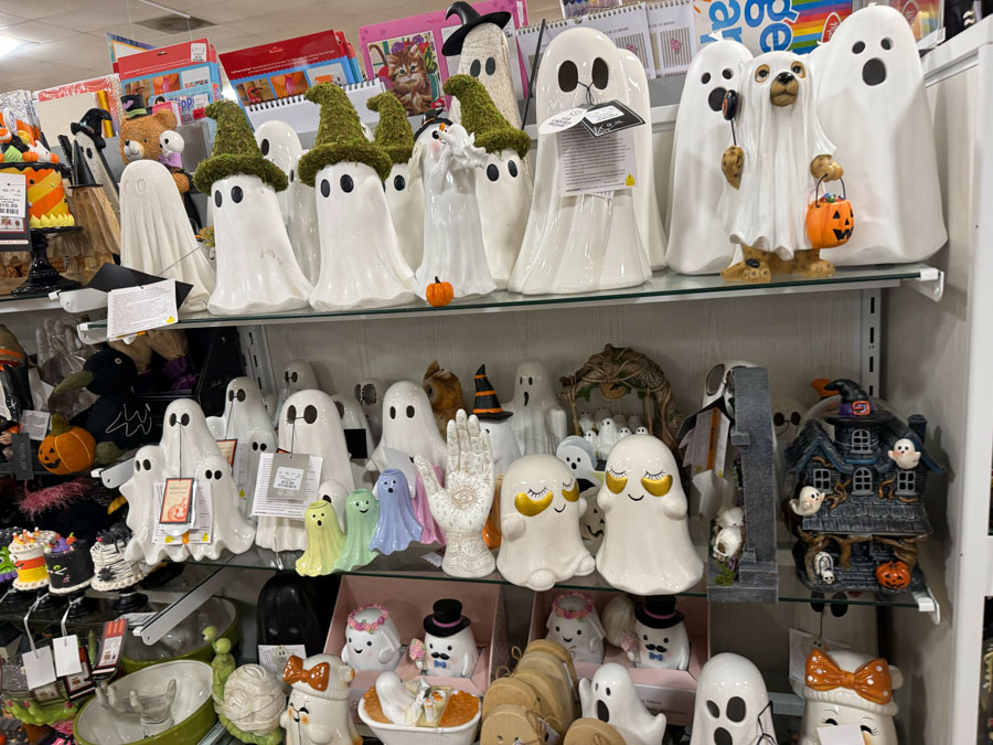 White ceramic Halloween ghosts with green witch hats at TJ Maxx