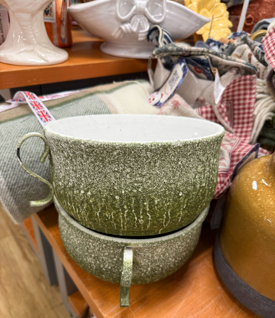 Oversized green ceramic cups displayed with fall home accessories at TJ Maxx